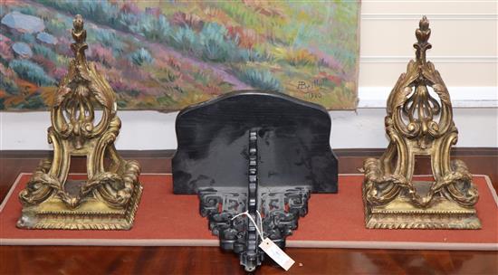 A pair of gilt wood wall brackets, carved with acanthus leaves and laurel swags and an ebonised bracket